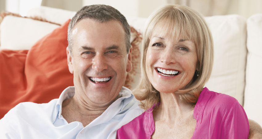 Couple with dentures smiles